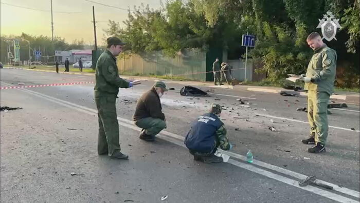 epa10131616 A still image taken from a handout video footage made available 21 August 2022 by the Russian Investigative Committee shows investigators working at the scene of a car explosion on Mozhaisk highway near the village of Bolshiye Vyazemi in the Odintsovo urban district in the Moscow region, Russia. In the evening of 20 August a Toyota Land Cruiser car blew up when the car was moving at full speed on a highway, and then burned. The driver, journalist and political scientist Darya Dugina, the daughter of the philosopher Alexander Dugin, died on the spot. According to Russian Investigative Committee, an explosive device was allegedly installed in the car. EPA/RUSSIAN INVESTIGATIVE COMMITTEE HANDOUT MANDATORY CREDIT/BEST QUALITY AVAILABLE HANDOUT EDITORIAL USE ONLY/NO SALES